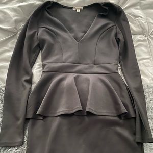 Form fitting tiered low cut black dress